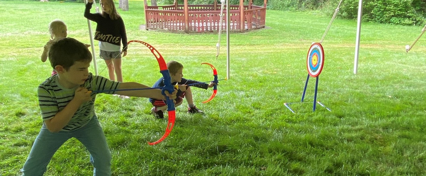 two young boys with bows and arrows