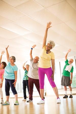 senior citizen women in a group exercise class