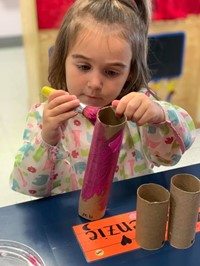 child doing a craft project